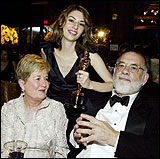 Sofia Coppola, center, with her parents, director Francis Ford Coppola and Eleanor, at the Governor's Ball following the 76th annual Academy Awards in Hollywood.