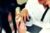 Student practicing on single nails at the Hayward Beauty College.